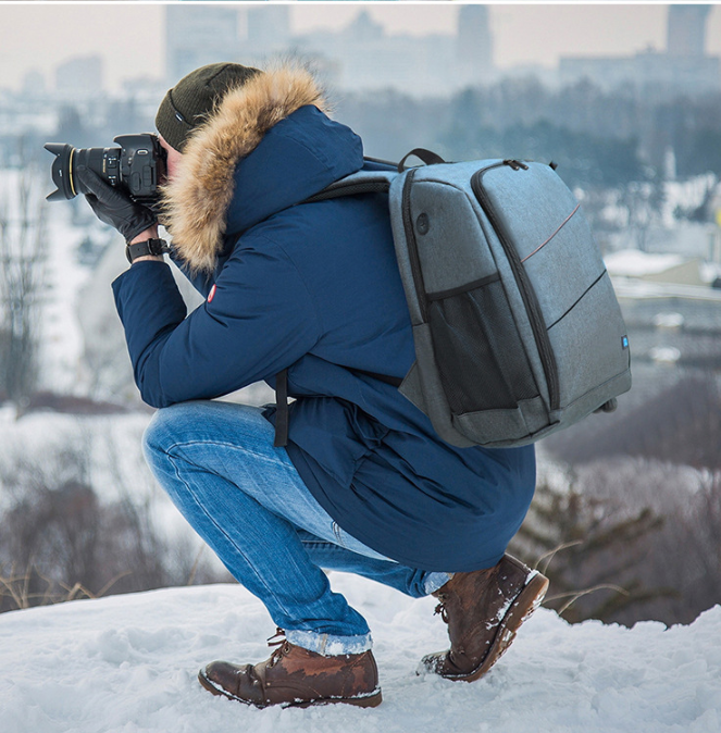 PULUZ Outdoor Camera Backpack - Professional storage for sports essentials. Comfortable handles, spacious, waterproof, and wear-resistant. Ideal for DSLR, lenses, and accessories. Multiple pockets for organization. Perfect for outdoor adventures.