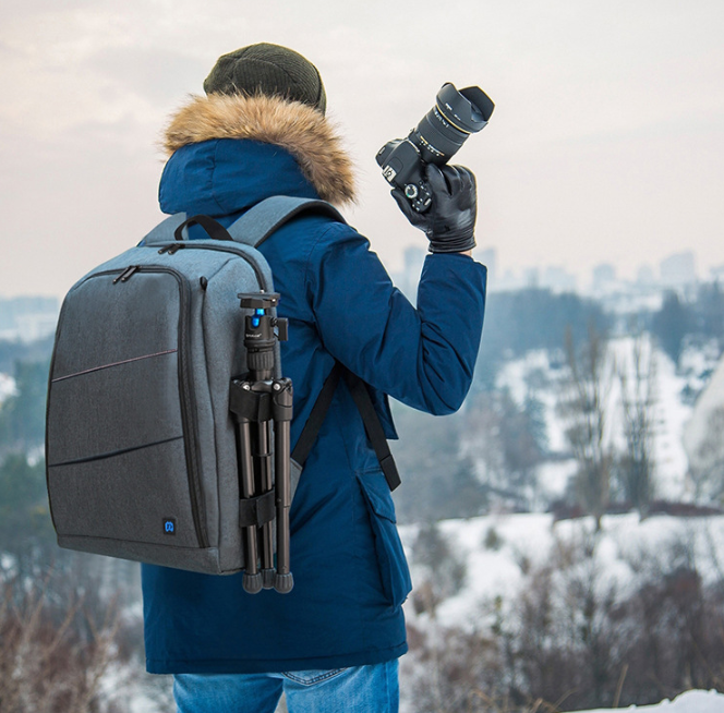 PULUZ Outdoor Camera Backpack - Professional storage for sports essentials. Comfortable handles, spacious, waterproof, and wear-resistant. Ideal for DSLR, lenses, and accessories. Multiple pockets for organization. Perfect for outdoor adventures.